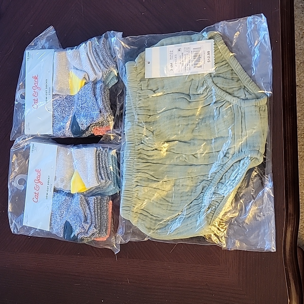Bundle of 2packs of 12-24 month socks 6 pairs per pack 1 2pack of diaper covers.